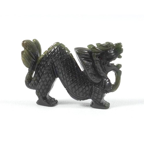 197 - Green jade carved in the form of a dragon, length 5.5 cm