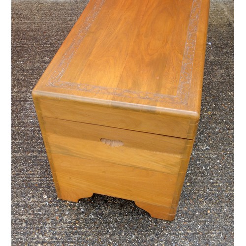 328 - Oriental teak chest with carved bands, hinged top and camphorwood lined interior with sliding tray, ... 