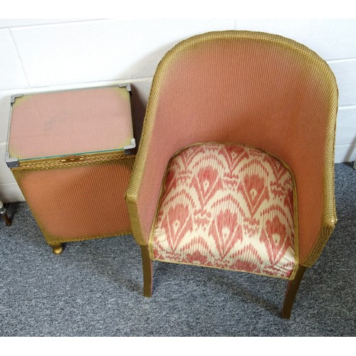 330 - Kraft pink and gilt loom armchair with a patterned upholstered seat, and a rectangular linen bin wit... 