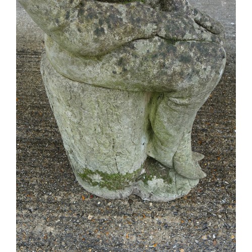 341 - DSL composition figure of a laughing gnome, sitting on a tree trunk base, H 96cm