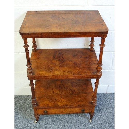 335 - Victorian walnut 3 tier whatnot with a drawer below, on turned columns, tapering feet and castors, W... 