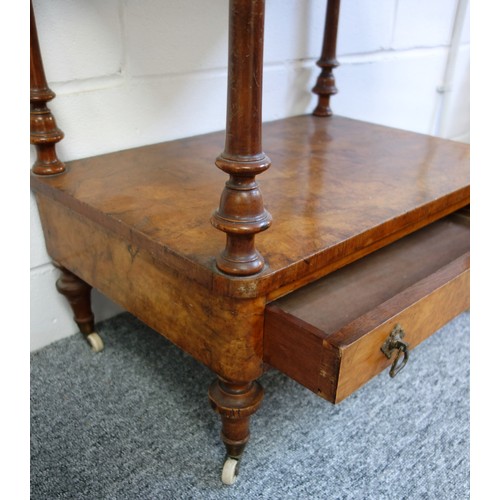 335 - Victorian walnut 3 tier whatnot with a drawer below, on turned columns, tapering feet and castors, W... 