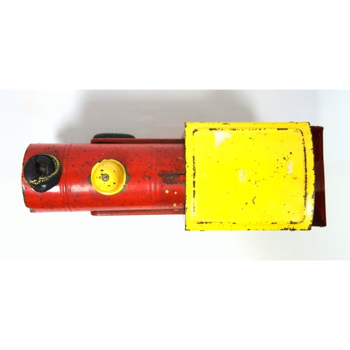 218 - Triang red and yellow tinplate model of a locomotive, the front wheels turning to pump bellows in ca... 