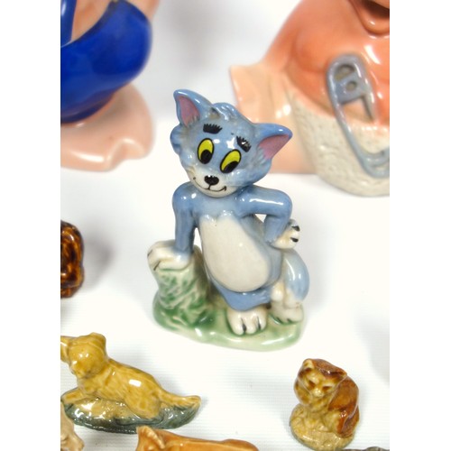 233 - Three Wade Natwest pigs, Disney cat “Tom”, H 9.2cm, Bear “Yogie”, H 6.3cm, and a quantity of whimsie... 