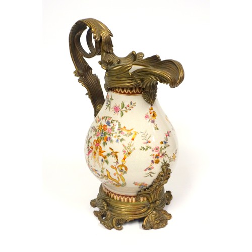 234 - Ceramic baluster jug with heavy brass mounts and a cherub and floral decoration, with the mark of Wo... 