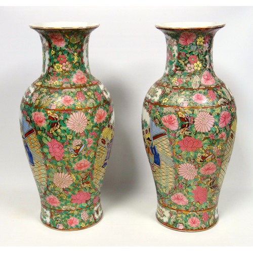 216 - Pair of 20th century Chinese Canton baluster vases, each painted with 2 reserves of figures in a gar... 