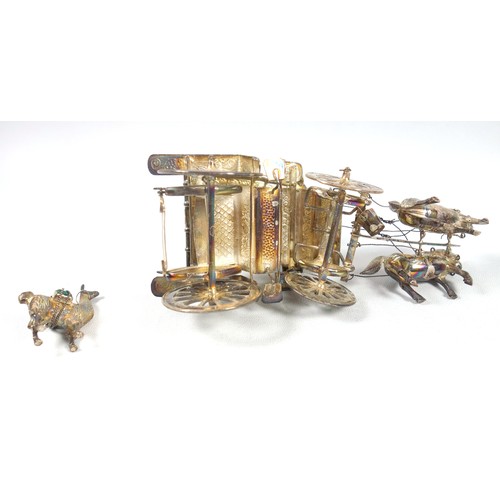 3 - Burmese white metal model of a covered carriage with figure and 2 horses, L 15.7cm, model of a llama... 