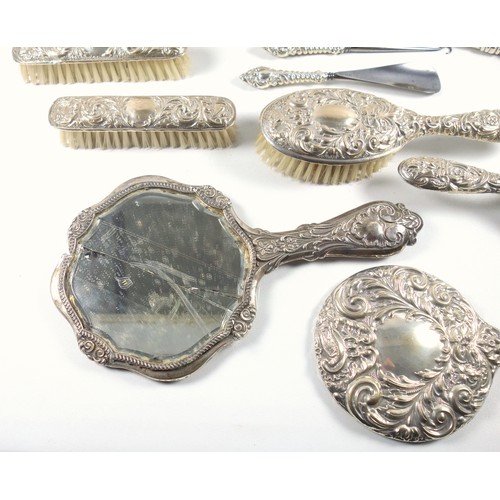 15 - Edwardian 5 piece silver mounted dressing table set with embossed floral decoration and monogram, co... 