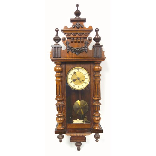 31 - A Viennese style regulator with an 8 day striking movement in a stained beech case, 94 cm long