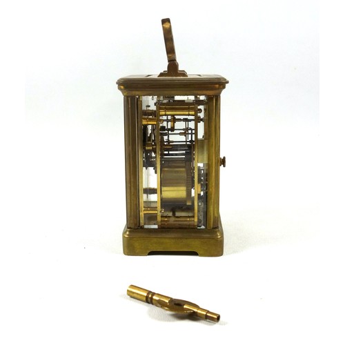 34 - An early 20th century brass carriage timepiece with white Roman numeric dial, marked 