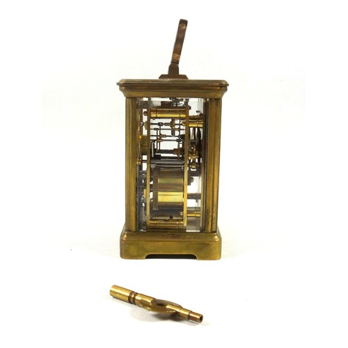 34 - An early 20th century brass carriage timepiece with white Roman numeric dial, marked 