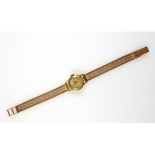 36 - Longines 18ct gold Ladies wristwatch with a circular dial and baton markers, enclosing a side wind m... 