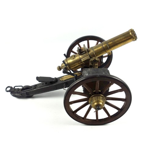 70 - Desktop model of a Gatling field gun, the brass barrel with turning mechanism mimicking firing actio... 