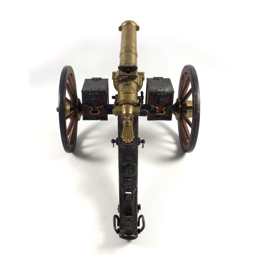 70 - Desktop model of a Gatling field gun, the brass barrel with turning mechanism mimicking firing actio... 