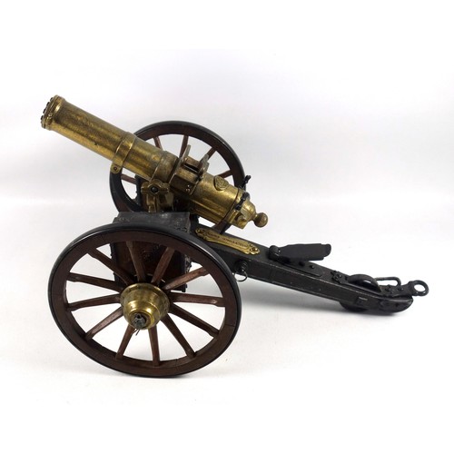 70 - Desktop model of a Gatling field gun, the brass barrel with turning mechanism mimicking firing actio... 