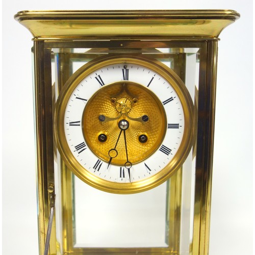 53 - Late 19th century 4-glass clock with a gilt circular dial with visible escapement, white enamelled c... 