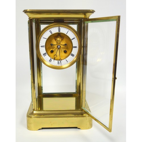 53 - Late 19th century 4-glass clock with a gilt circular dial with visible escapement, white enamelled c... 