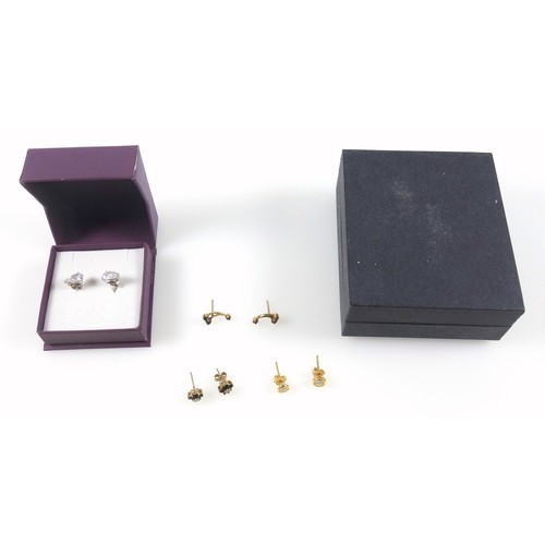 492A - Pair of white gold stud earrings, each set with a clear stone, stamped 