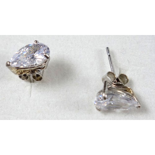 492A - Pair of white gold stud earrings, each set with a clear stone, stamped 