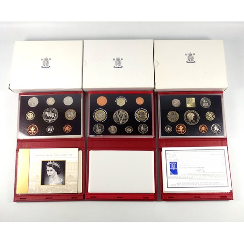 569 - Elizabeth II de luxe Proof sets of coins, 1999-2004, including the 2000 Millennium Executive set, in... 