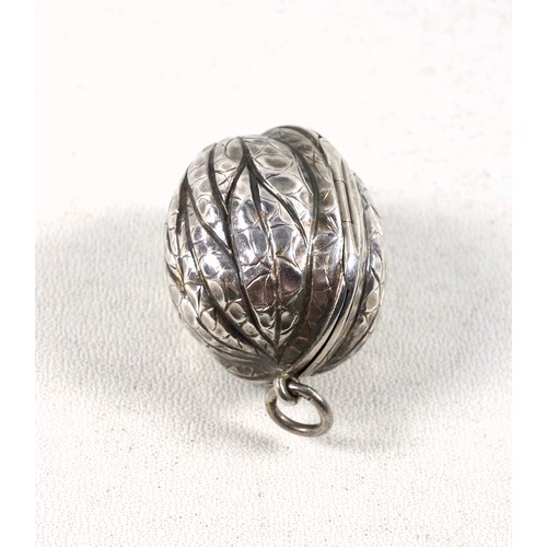 42 - Late Victorian silver vinaigrette in the form of a walnut, the hinged cover, rising to disclose a gi... 