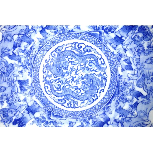 135 - Early 20th century Chinese blue and white saucer dish with a central roundel containing a pair of ce... 