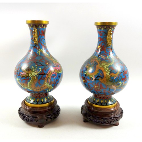 113 - Pair of Chinese cloisonne baluster vases, each with dragon and floral decoration on a turquoise grou... 