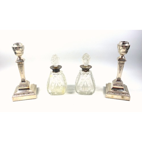 1 - Pair of Edwardian silver candlesticks with an urn shaped sconce, square section tapering column, on ... 