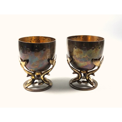 2 - Pair of Arts & Crafts silver and gilt goblets, each as a circular bowl with a gilt interior supporte... 