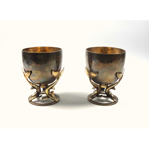2 - Pair of Arts & Crafts silver and gilt goblets, each as a circular bowl with a gilt interior supporte... 