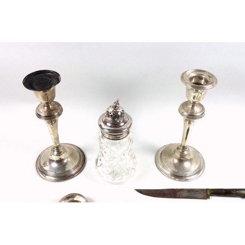8 - Pair of silver candlesticks, each with a tapering cylindrical column and reeded bands, by W J M & Co... 