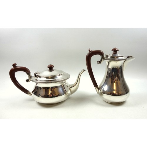 9 - George V silver 4 piece tea set with circular teapot with hinged domed cover, bakelite finial and lo... 