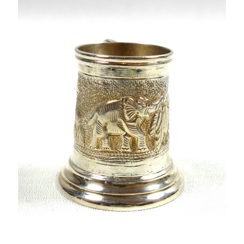 32 - Indian silver miniature mug with embossed elephant and foliate decoration, stamped 