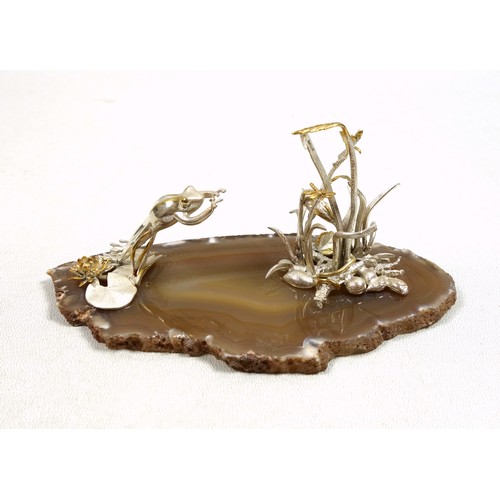 34 - Silver model of a frog, leaping from a lily pad to catch a dragonfly in the reeds, London Import Mar... 