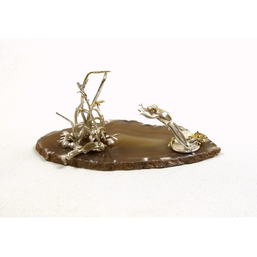 34 - Silver model of a frog, leaping from a lily pad to catch a dragonfly in the reeds, London Import Mar... 