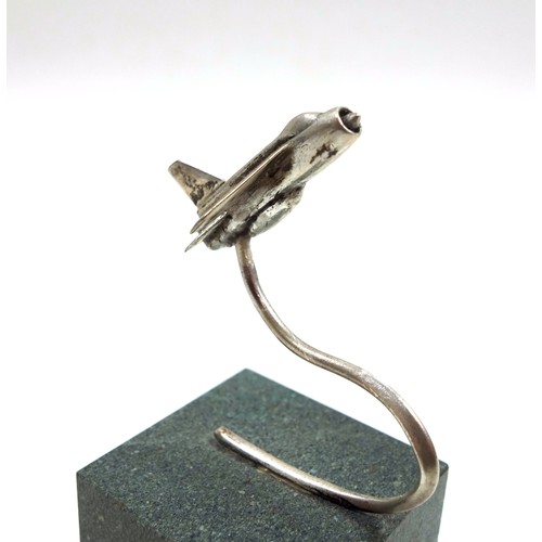 44 - Novelty silver desk top paperweight in the form of a fighter jet, mounted on a stone base, London, 1... 