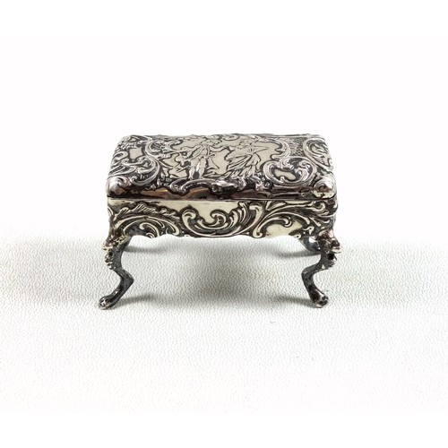 49 - Novelty silver table top pinch or pill box in the form of a piano stool with all over rococo decorat... 