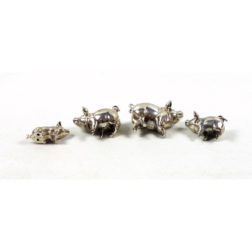 62 - Hollow cast silver family of 4 silver pigs, by M H, Birmingham, 104grs. (4)