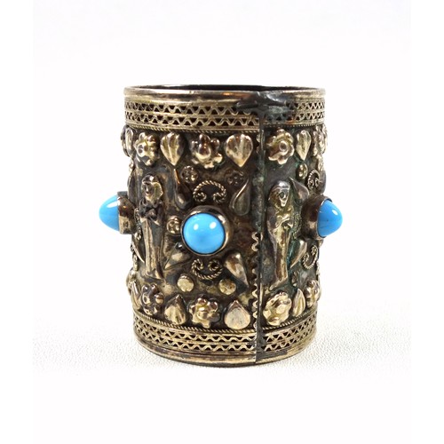 65 - Egyptian silver beaker with 5 turquoise cabochons and mummies in relief, 800 standard, H.6cm, 75grs;... 