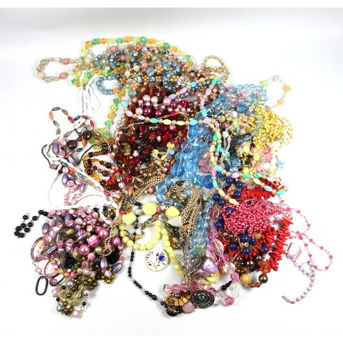 70 - Large quantity of necklaces, brooches, bangles, and other costume jewellery. (a lot)