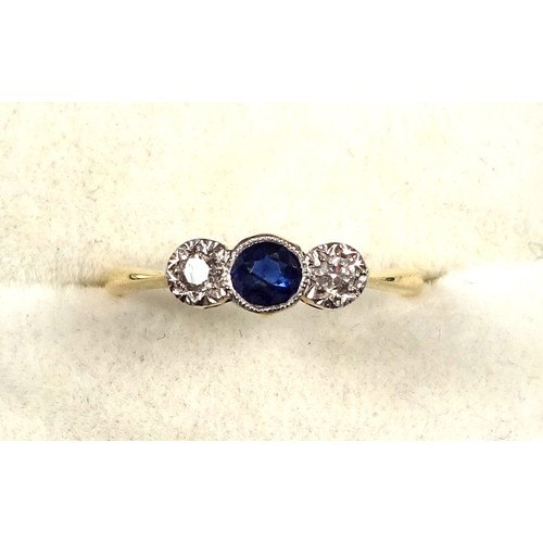 75 - 18ct gold and platinum ring c. 1920's, size M, with a 4mm old cut Indian sapphire offset at sides by... 