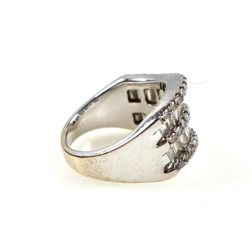 87 - White metal ring set 26 baguette and 42 round cut diamonds, stamped 