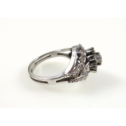 88 - Platinum ring with 33 round cut diamonds in a floral setting, size O 1/2 approx., 7.8grs