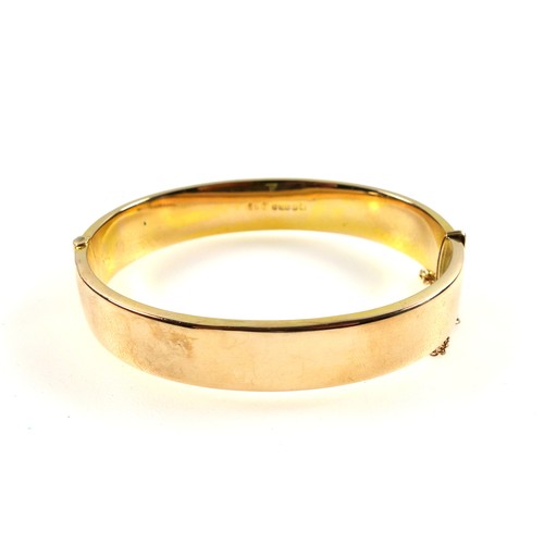 90 - 9ct gold bracelet, half decorated with a scrolling foliate design, internal width 6cm, 13.4 grams.