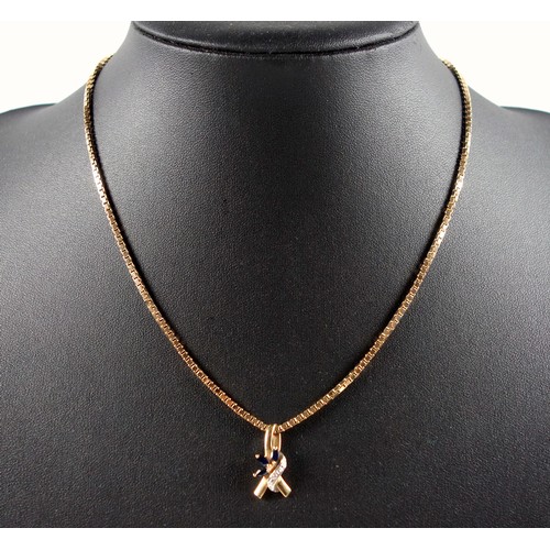 92 - Italian 9ct gold box link necklace, 11.4 grams, and a yellow metal ribbon sapphire and diamond penda... 