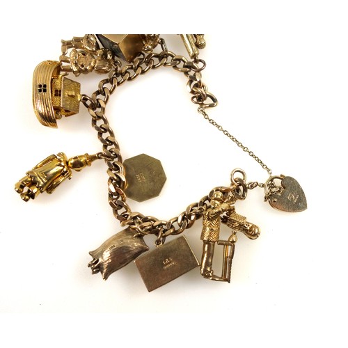 94 - 9ct gold curb-link bracelet with eleven 9ct and yellow metal charms, 69.4grs.