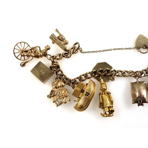 94 - 9ct gold curb-link bracelet with eleven 9ct and yellow metal charms, 69.4grs.