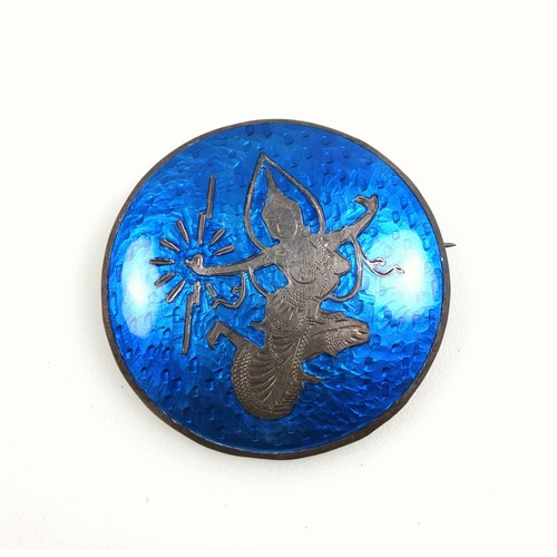 108 - Siamese domed enamelled brooch with a dancer on a blue ground, marked 
