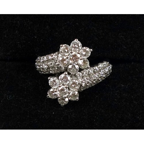 169 - White metal and diamond 'starry' cluster styled ring, stamped 750, 2.5cts diamonds approx., ring siz... 