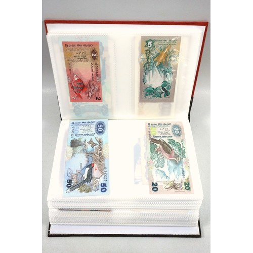 410 - Three albums containing over 20 banknotes, 19th and 20th century postcards (over 300), including Cun... 